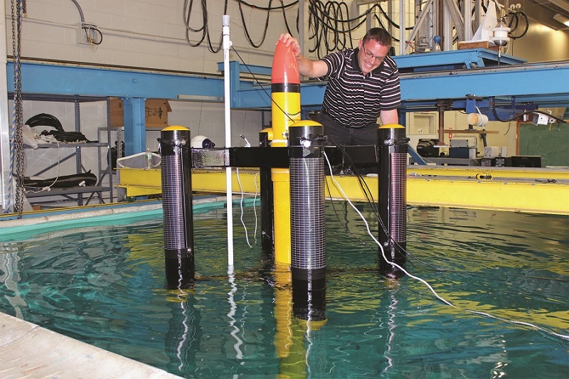 ESL Engineer Testing Wave Energy Sensor Buoy in Wave Tank at URI